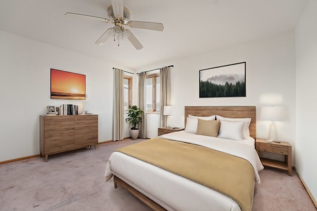 bedroom featuring ceiling fan and light carpet