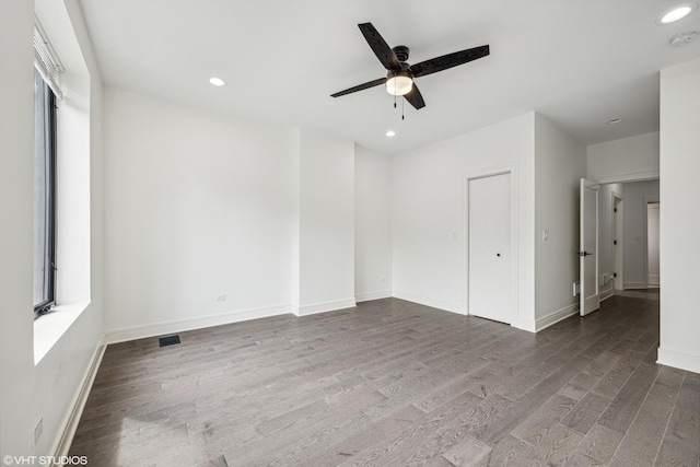 unfurnished room with ceiling fan and wood-type flooring