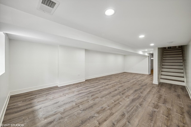 basement featuring light hardwood / wood-style floors