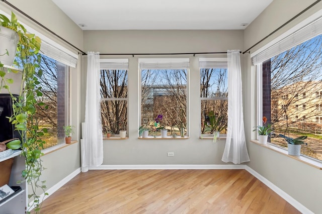 unfurnished sunroom with a wealth of natural light