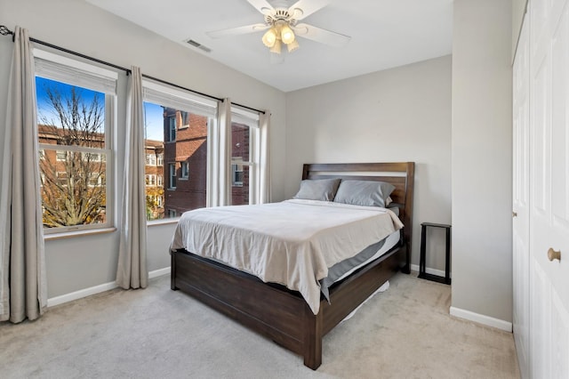 carpeted bedroom featuring ceiling fan