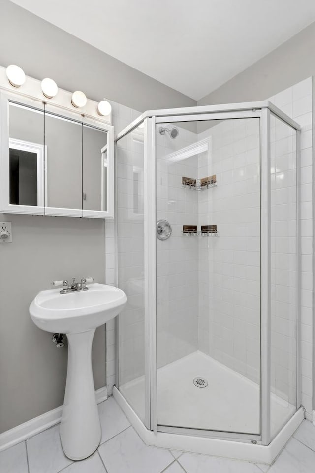 bathroom featuring sink and an enclosed shower