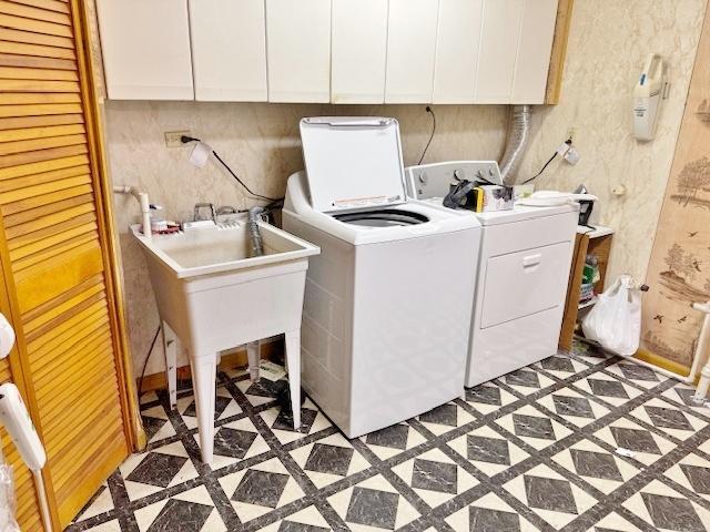 1429 N Wolf Rd, Berkeley, IL 60163 - washroom featuring inlaid floor details, washing machine and dryer, and cabinet space