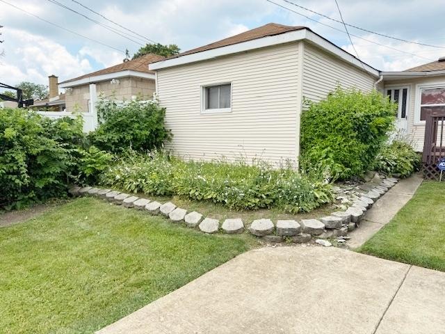 1429 N Wolf Rd, Berkeley, IL 60163 - view of property exterior with a yard