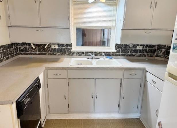 1429 N Wolf Rd, Berkeley, IL 60163 - kitchen featuring black dishwasher, light countertops, white cabinetry, and backsplash