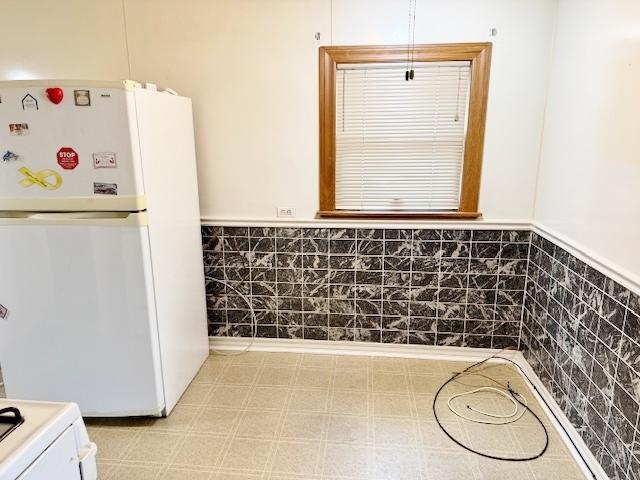 1429 N Wolf Rd, Berkeley, IL 60163 - kitchen with white appliances and wainscoting