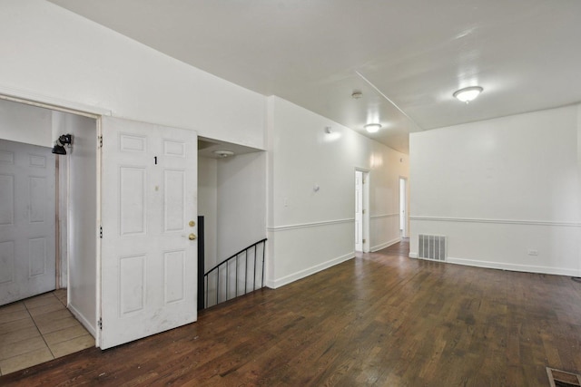 unfurnished room featuring dark hardwood / wood-style flooring