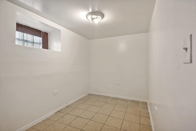 empty room with light tile patterned floors