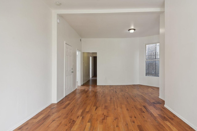 spare room featuring dark hardwood / wood-style flooring