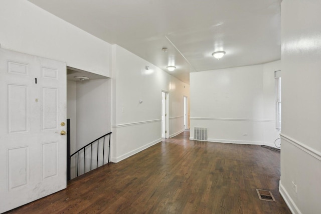 spare room featuring dark hardwood / wood-style flooring