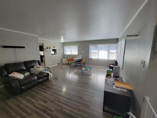 living room featuring hardwood / wood-style floors and crown molding