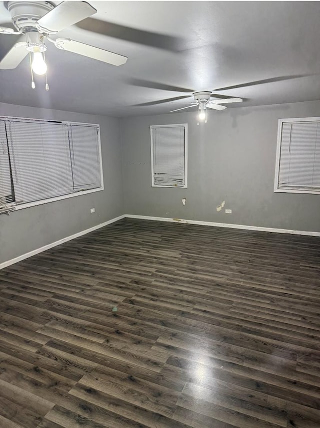 empty room with dark hardwood / wood-style floors