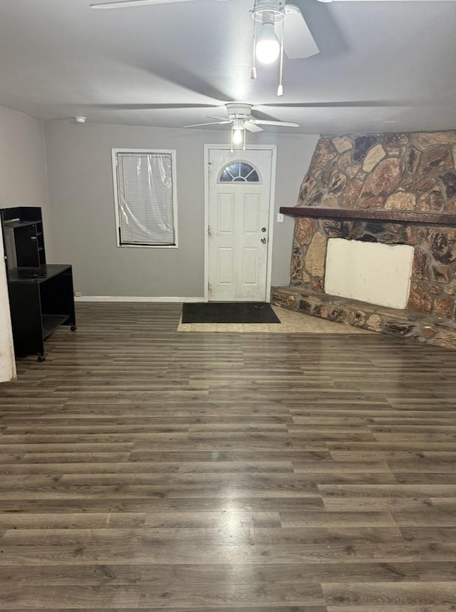 foyer entrance with dark hardwood / wood-style floors and ceiling fan