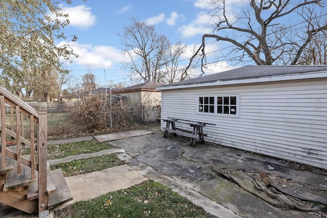 view of patio / terrace with an outbuilding