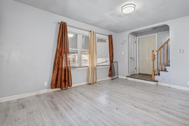 spare room with light hardwood / wood-style floors