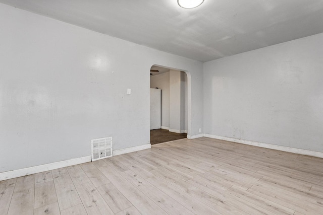 empty room with light hardwood / wood-style floors