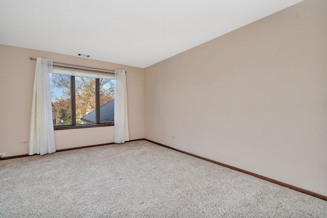 unfurnished room with light colored carpet