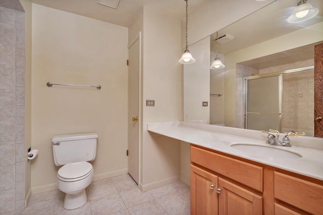 bathroom with tile patterned floors, vanity, walk in shower, and toilet