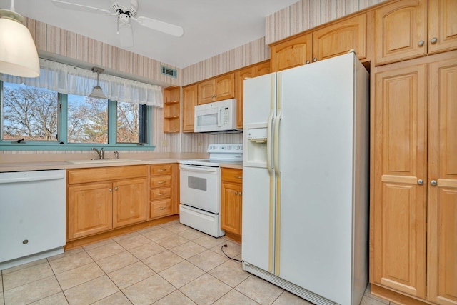 kitchen featuring white appliances, sink, ceiling fan, decorative light fixtures, and light tile patterned flooring