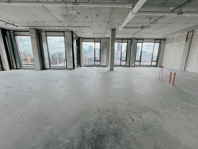 misc room featuring concrete flooring and a healthy amount of sunlight