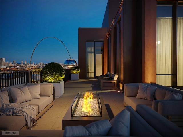 patio terrace at dusk with an outdoor living space with a fire pit