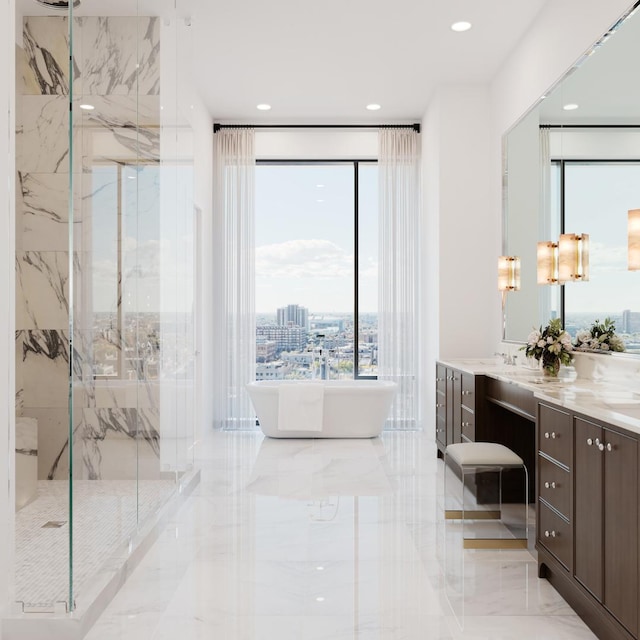 bathroom with vanity and independent shower and bath