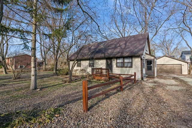 view of front of home with an outdoor structure and a garage