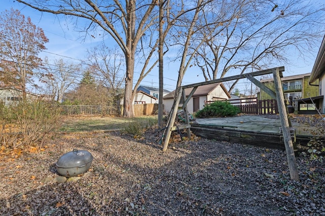 view of yard with a wooden deck