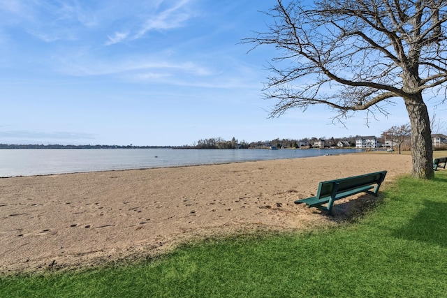 surrounding community featuring a water view