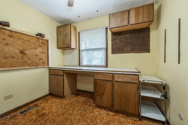 kitchen featuring carpet flooring and ceiling fan