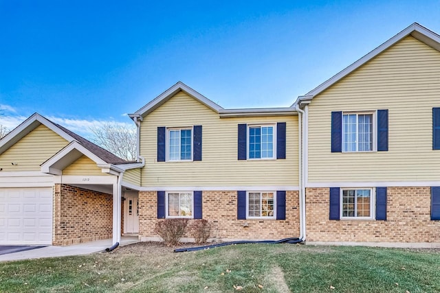 view of front of property with a garage and a front yard