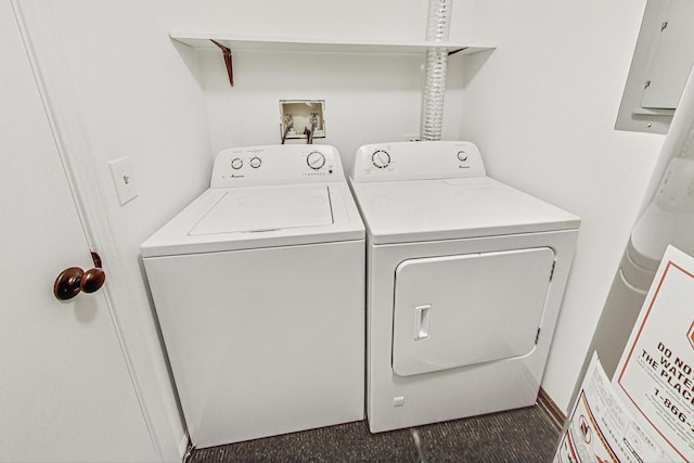 washroom featuring washer and dryer and electric panel