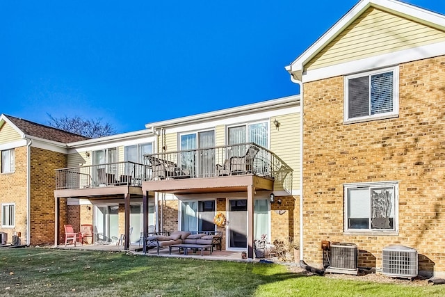 back of property featuring outdoor lounge area, a balcony, central air condition unit, and a patio