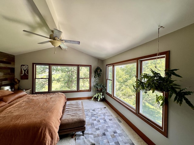 carpeted bedroom featuring ceiling fan and vaulted ceiling