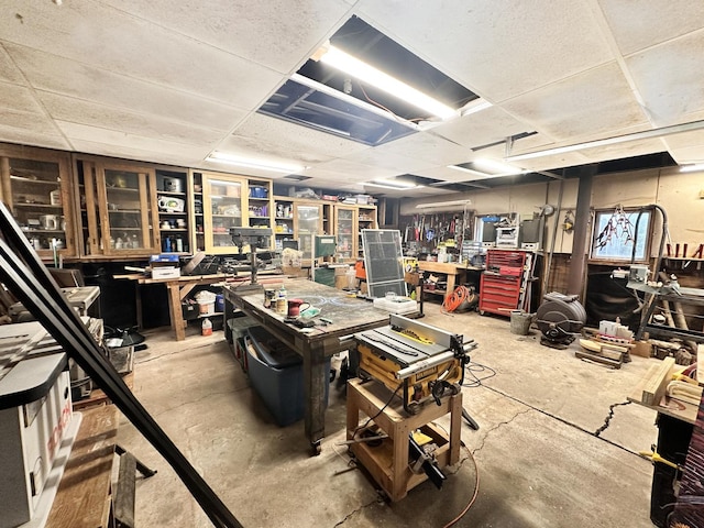 misc room featuring a workshop area and concrete floors