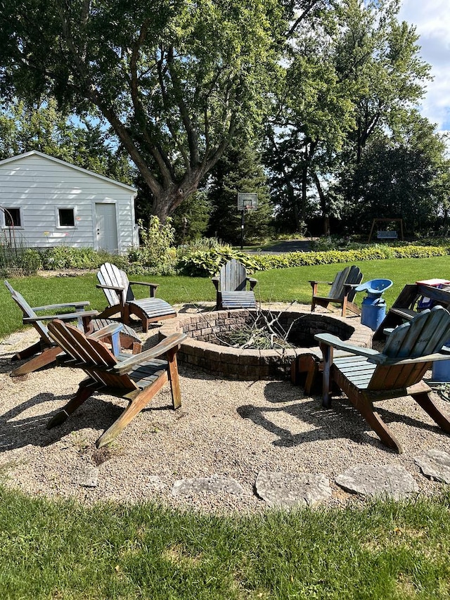 view of patio / terrace featuring an outdoor fire pit