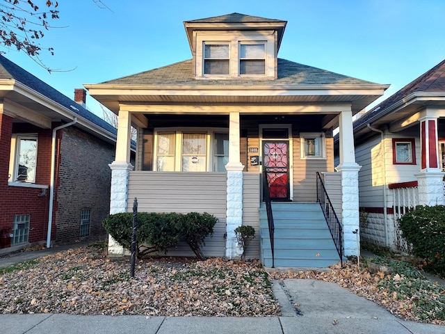 1408 W 71st Pl, Chicago, IL 60636 - view of front of house featuring a porch and roof with shingles