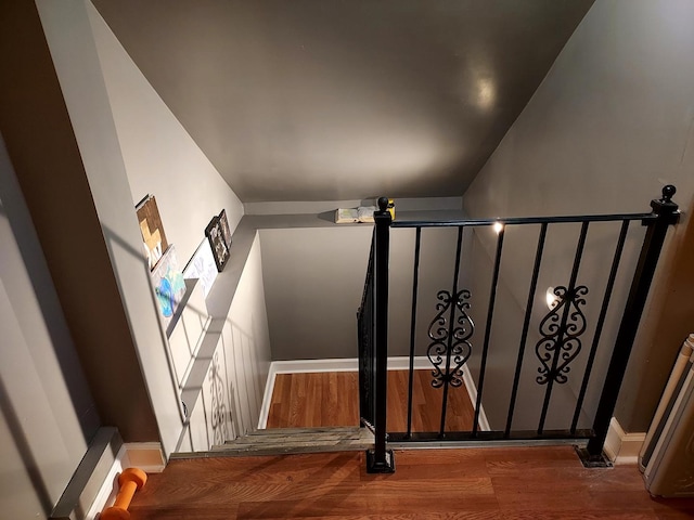 stairs featuring hardwood / wood-style flooring