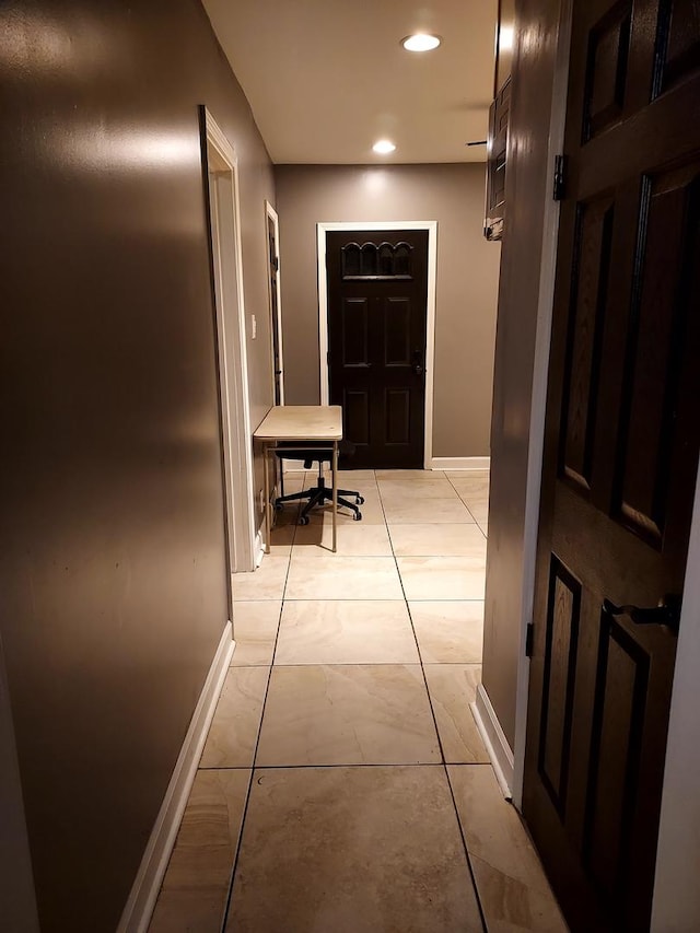 corridor featuring light tile patterned floors