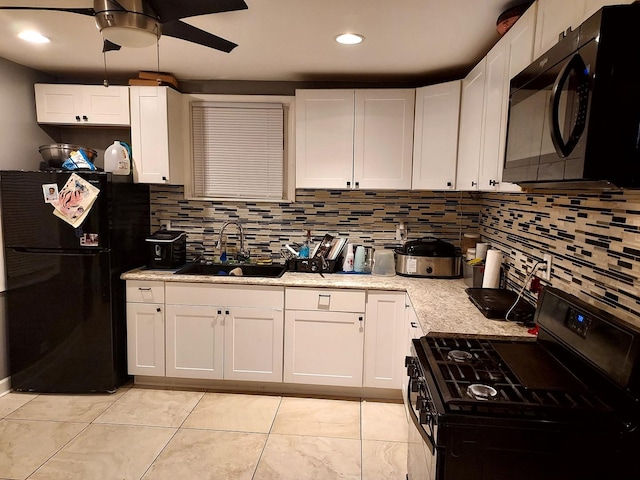 kitchen featuring sink, white cabinetry, ceiling fan, and black appliances