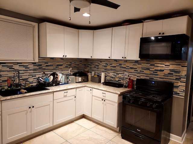 1408 W 71st Pl, Chicago, IL 60636 - kitchen featuring black appliances, decorative backsplash, white cabinetry, a ceiling fan, and light tile patterned floors