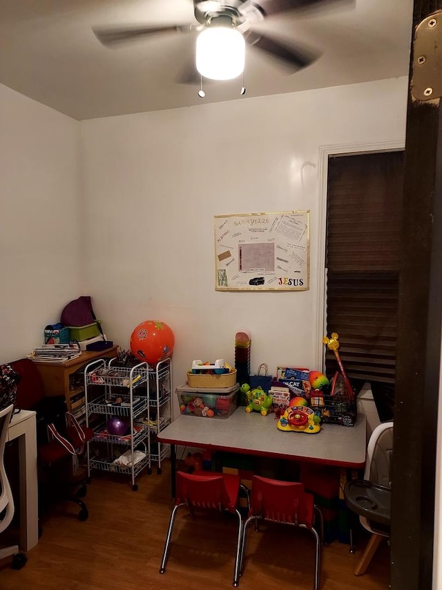 game room with ceiling fan and wood-type flooring