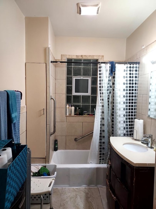 bathroom with vanity and shower / bathtub combination with curtain