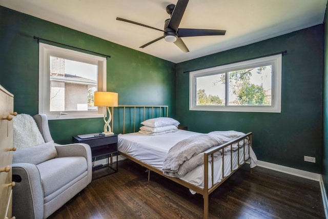 bedroom featuring ceiling fan and dark hardwood / wood-style flooring