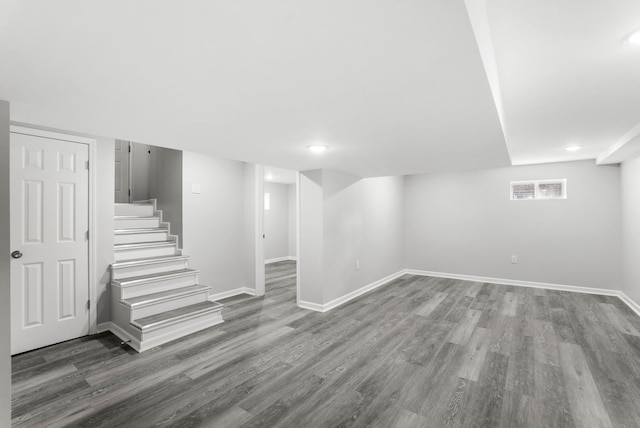 basement with hardwood / wood-style flooring