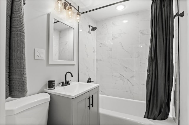 full bathroom with vanity, toilet, and shower / tub combo with curtain