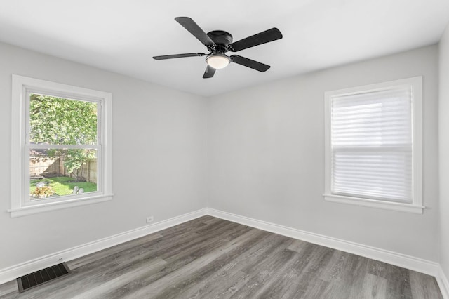 empty room featuring hardwood / wood-style flooring and ceiling fan