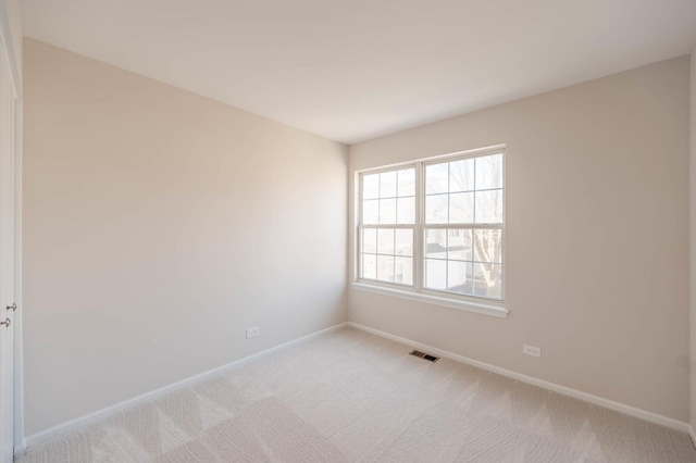 empty room with light colored carpet