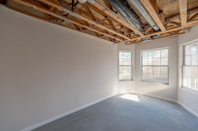 spare room with concrete flooring