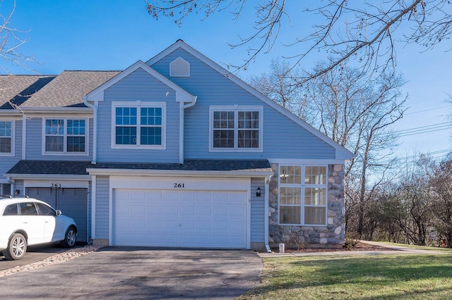 front of property with a garage